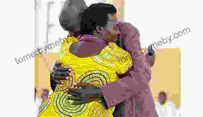 A Survivor And Perpetrator Embrace, Symbolizing Reconciliation. As We Forgive: Stories Of Reconciliation From Rwanda