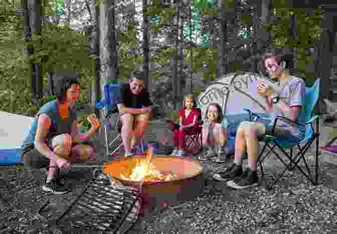 Diverse Group Of Campers Enjoying A Campfire Heading Out: A History Of American Camping